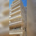 الترافرتين الكريمي المموج واجهات المباني السكنية