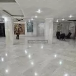سنگ مرمریت روشن - تایل شهیادی در کف لابی ساختمان